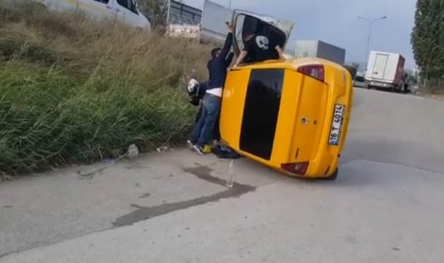 Bursa'da kamyonun sıkıştırdığı taksi takla attı: 2 yaralı