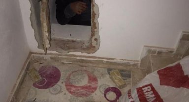 Antalya'da farklı suçlardan aranan hükümlü, duvardaki gizli bölmede yakalandı