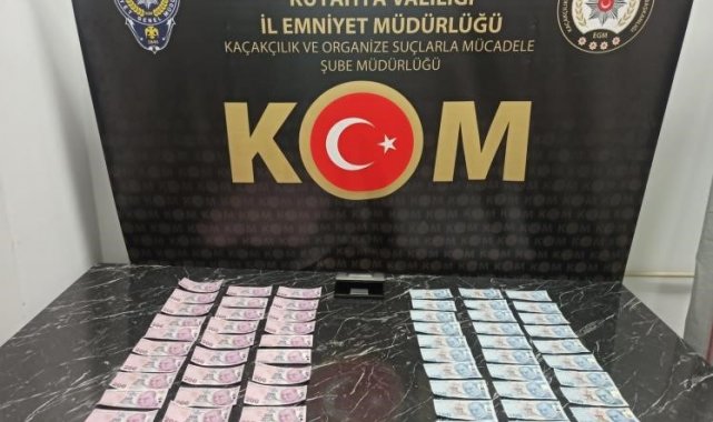 Kütahya'da ormanlık alanda toprağa gömülü 9 bin 500 TL sahte para bulundu