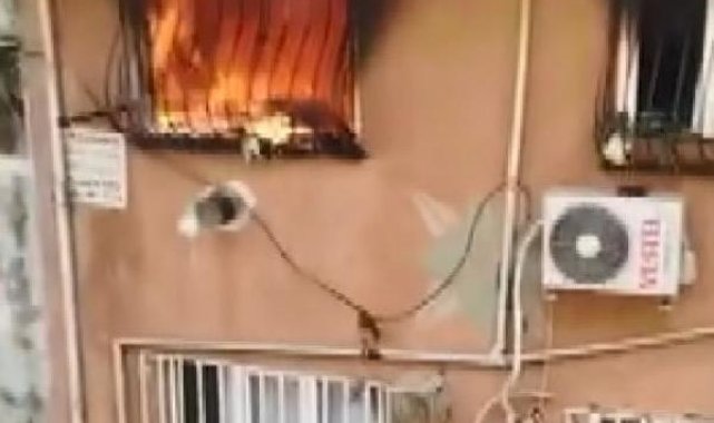 Gaziosmanpaşa'da yangında mahsur kalan kadını sürükleyerek çıkardı
