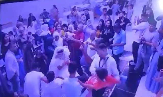 Damat, para takılı gelinliği çekiştiren çocuğu fırlatıp yere attı