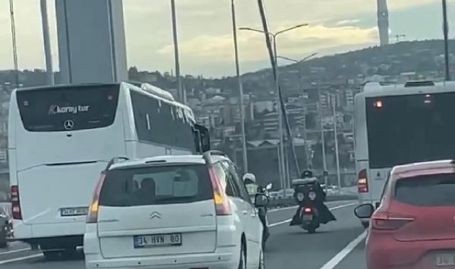 Fırtınada köprüyü geçmeye çalışan motosikletlilere kalkan oldular