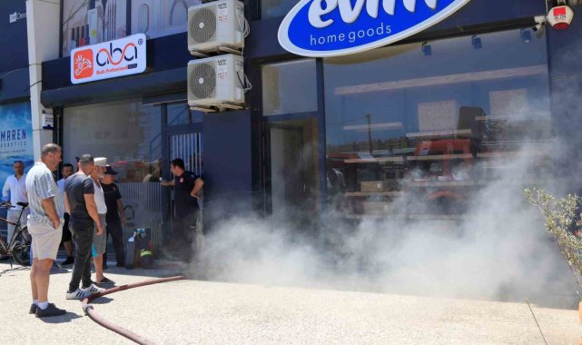 İşyerinin yanışını çaresiz bakışlarla izledi