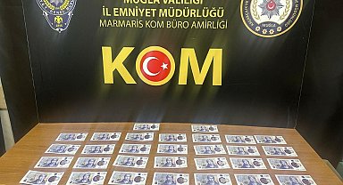 Marmaris'te sahte dövizle alışveriş yapan turist, sınır dışı edildi