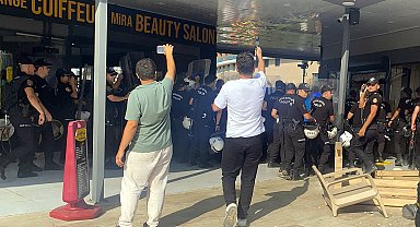 Antalya'da kaçak yapıların yıkımında arbede; kendilerini yakmaya çalışıp, iş makinelerinin önüne yattılar