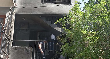 İzmir'de 3 katlı binada yangın paniği; Defne'yi mahalleli kurtardı