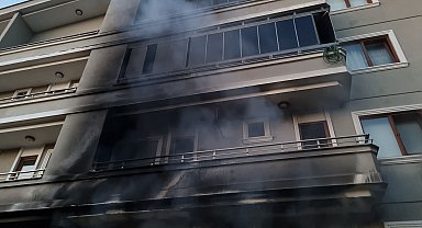 Binada çıkan yangında 2'nci katın balkonundan düşüp yaralandı