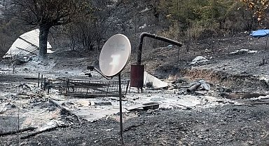 Yanan dağ evinden geriye çanak anten ile soba kaldı