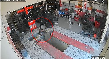 Oto lastikçide çalışan çırağın tamir çukuruna düştüğü anlar kamerada
