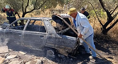 Yanan otomobilini uzaklaştırıp, alevlerin ormana sıçramasını önledi