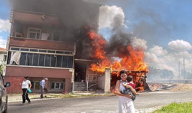 Alevler binanın garajını sardı, kardeşini kucağına alıp dışarı kaçtı