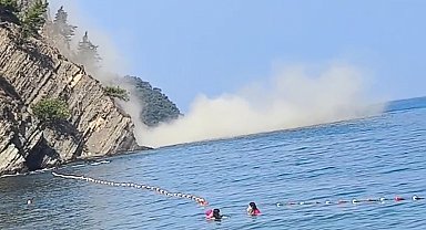 Denizde yüzerken 200 metre mesafede heyelan meydana geldi; o anlar kamerada