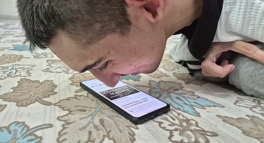 Burnu ile cep telefonu kullanan 'serebral palsili' Osman'ın hedefi kitap yazmak