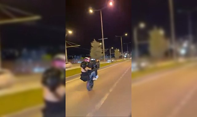 Motosikletlinin tek teker üzerinde tehlikeli yolculuğu kamerada